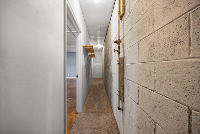 hall with concrete block wall