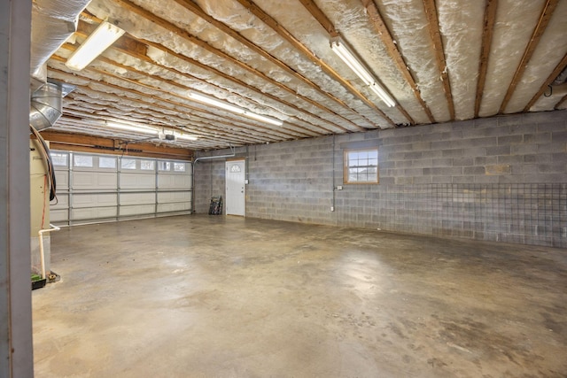 garage with concrete block wall