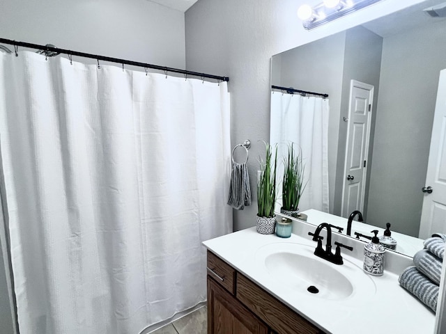 full bathroom with visible vents and vanity