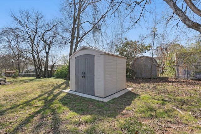 view of shed with fence