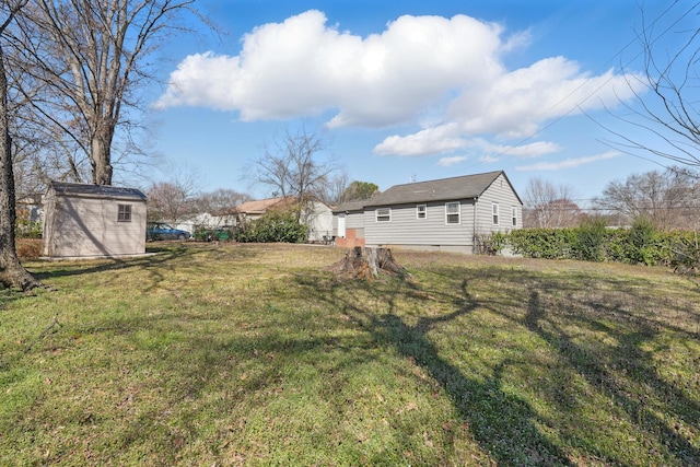 view of yard with an outbuilding and a shed