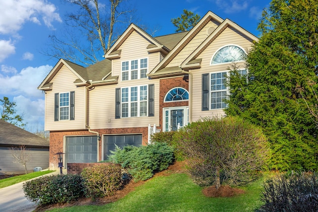 split foyer home with a garage and brick siding