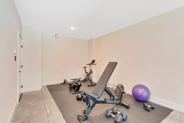 exercise area with recessed lighting and baseboards