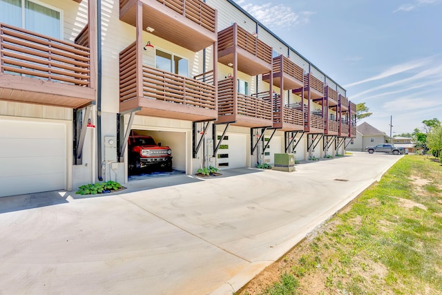 view of building exterior with a garage and driveway