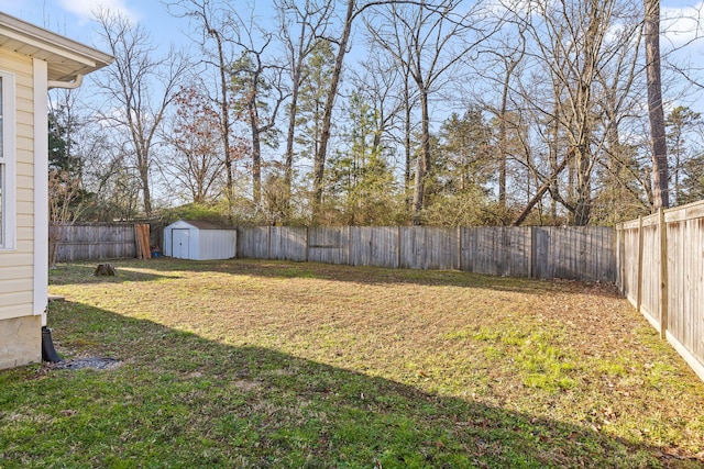 view of yard with a fenced backyard, an outdoor structure, and a shed