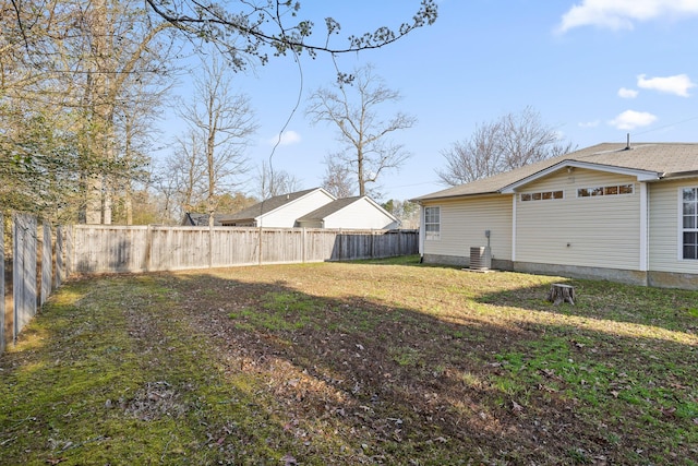 view of yard with cooling unit and a fenced backyard