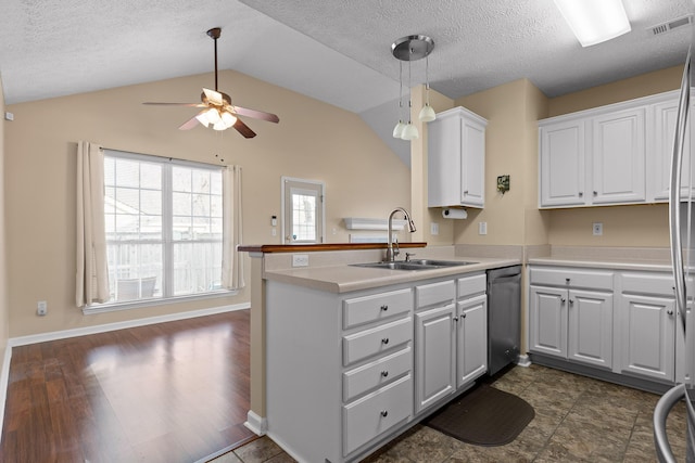 kitchen featuring visible vents, dishwasher, a peninsula, white cabinetry, and a sink