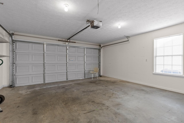 garage with baseboards and a garage door opener