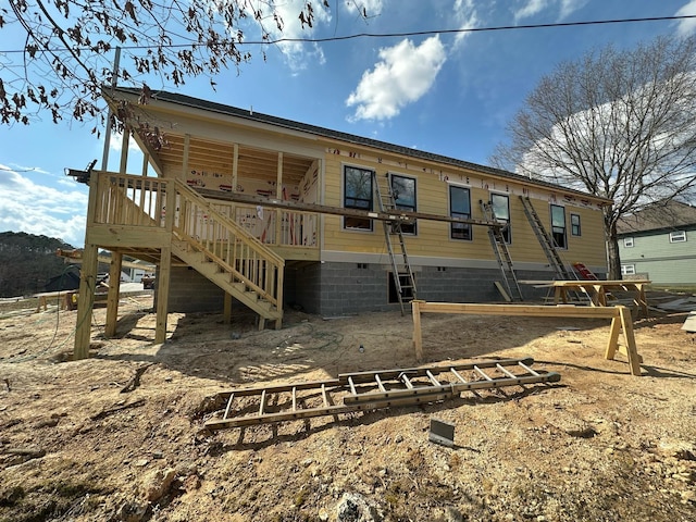 exterior space featuring stairs, a deck, and crawl space