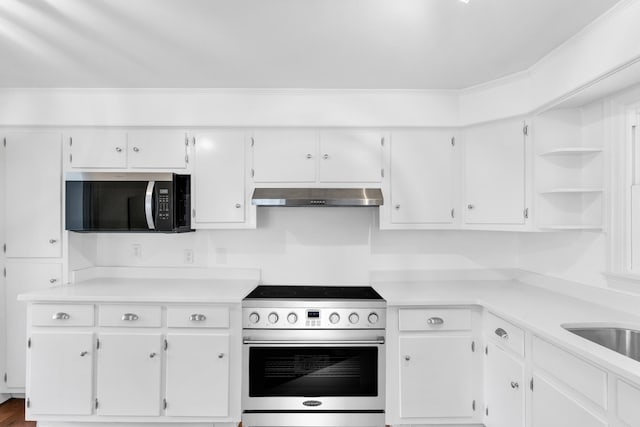 kitchen featuring under cabinet range hood, white cabinets, stainless steel appliances, and open shelves