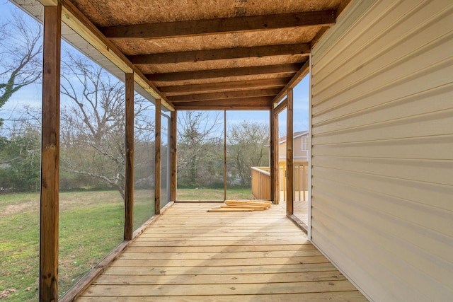 wooden deck featuring a yard