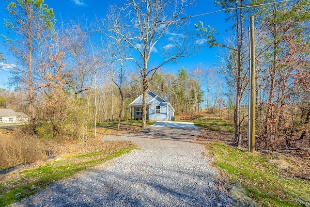 view of road featuring gravel driveway