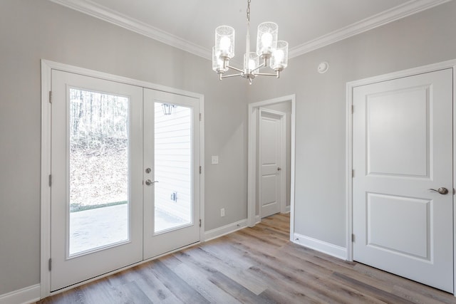 doorway to outside with baseboards, ornamental molding, french doors, wood finished floors, and a notable chandelier