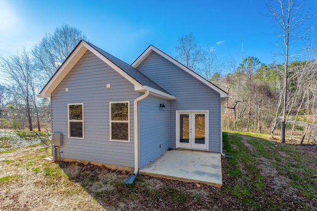 rear view of property featuring french doors and a patio