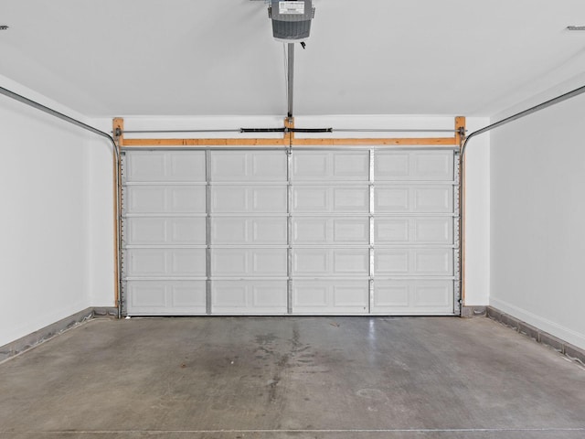 garage featuring baseboards and a garage door opener