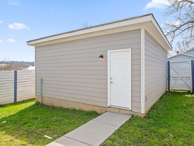 view of shed with fence