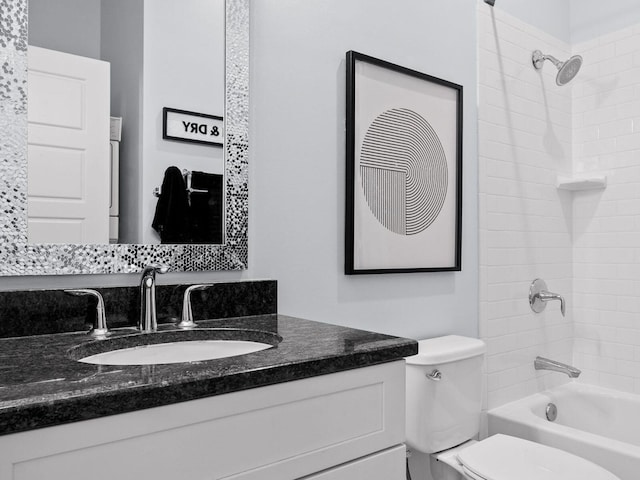 bathroom featuring shower / bathtub combination, toilet, and vanity