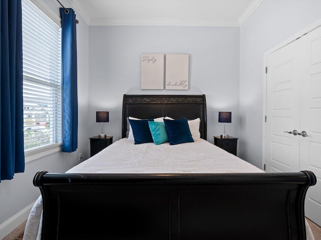 bedroom featuring baseboards and ornamental molding