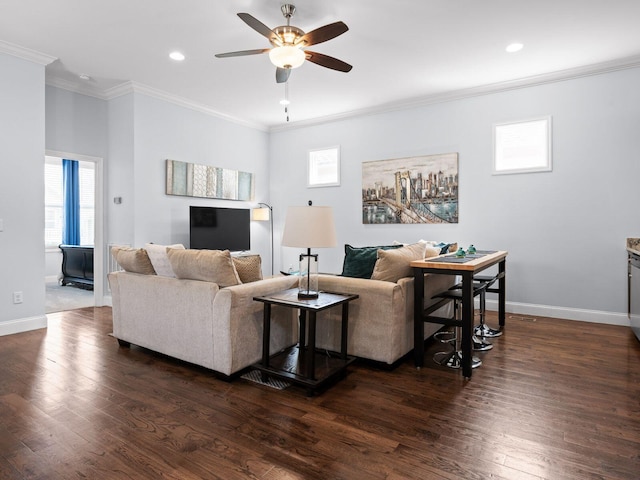 living area featuring ceiling fan, baseboards, dark wood-style floors, and ornamental molding