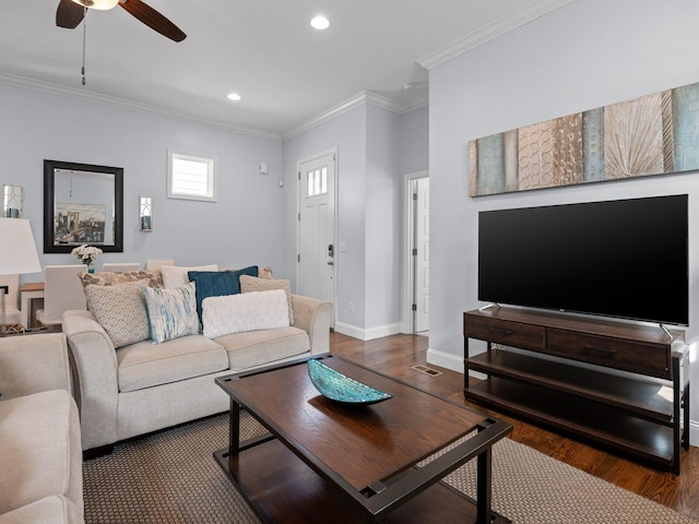 living area with wood finished floors, recessed lighting, crown molding, baseboards, and ceiling fan