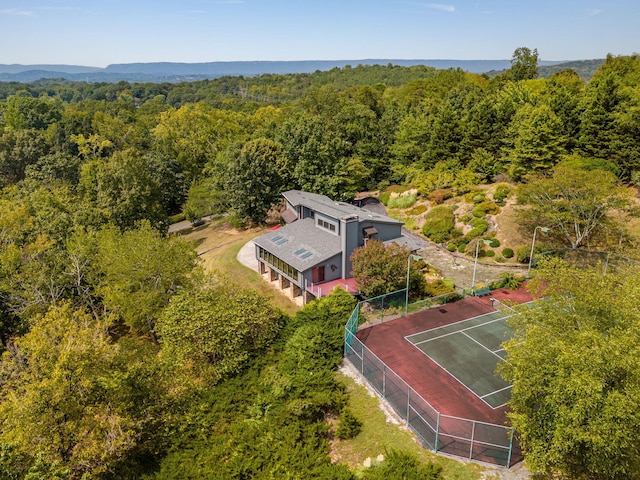 aerial view featuring a view of trees