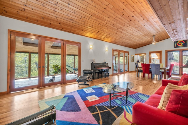 living area with wood finished floors, baseboards, vaulted ceiling, french doors, and wooden ceiling