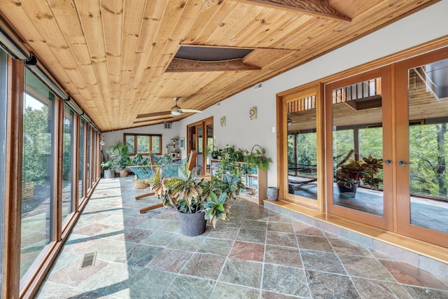 unfurnished sunroom with visible vents, wooden ceiling, and ceiling fan