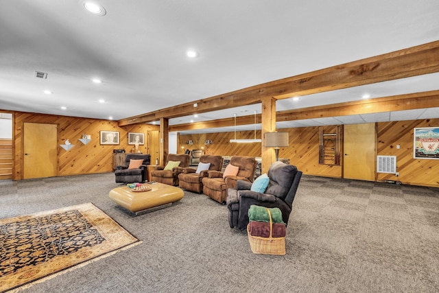 living area featuring recessed lighting, beamed ceiling, visible vents, and carpet