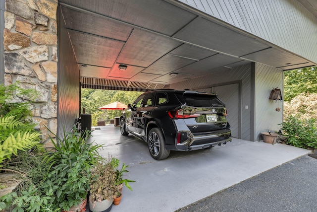 garage with an attached carport