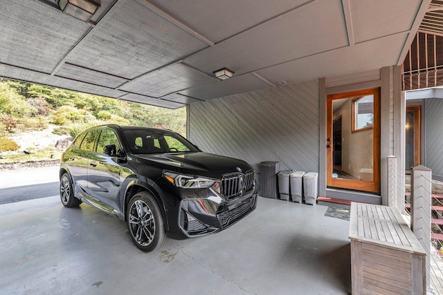 garage featuring a carport