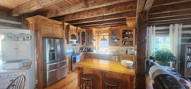 kitchen with backsplash, wooden counters, glass insert cabinets, beamed ceiling, and stainless steel appliances