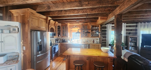 kitchen with light wood-type flooring, wood counters, tasteful backsplash, stainless steel appliances, and glass insert cabinets