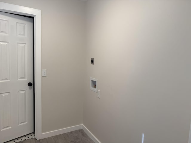 laundry area with baseboards, light wood finished floors, hookup for an electric dryer, laundry area, and washer hookup