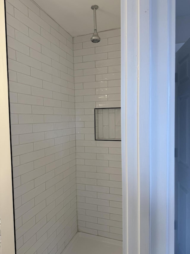 bathroom with a shower stall