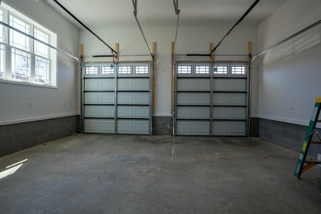 garage with concrete block wall