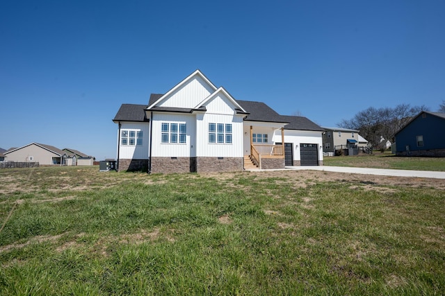 view of front of home featuring board and batten siding, a front yard, driveway, crawl space, and an attached garage