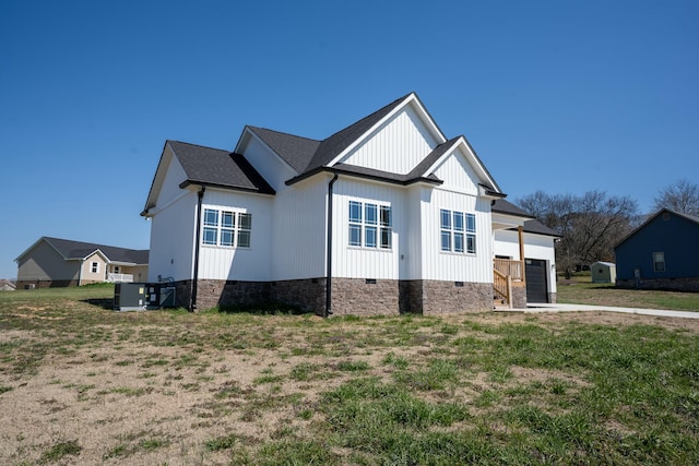 view of front of property featuring a garage, board and batten siding, concrete driveway, a shingled roof, and crawl space