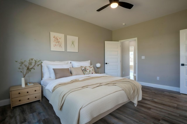 bedroom featuring a ceiling fan, baseboards, and wood finished floors