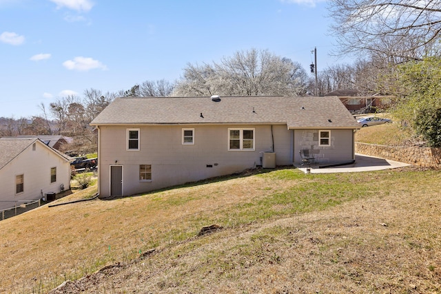 rear view of house with a patio, a lawn, central AC unit, and fence