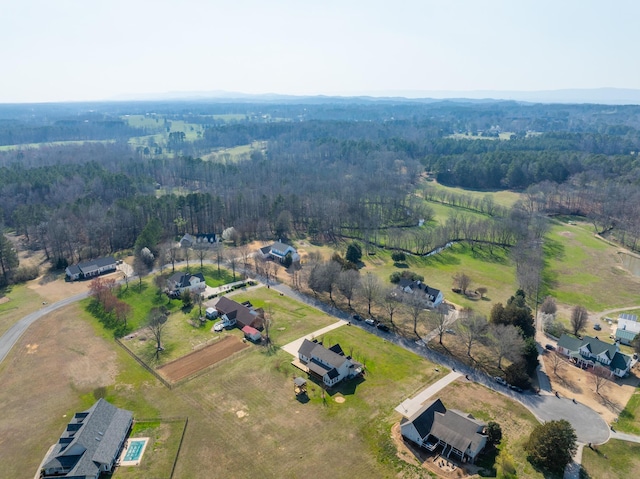 aerial view featuring a wooded view