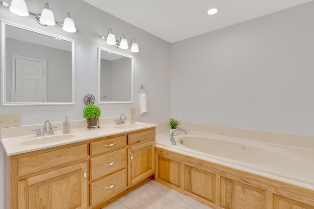 bathroom featuring a sink, a garden tub, double vanity, and tile patterned floors