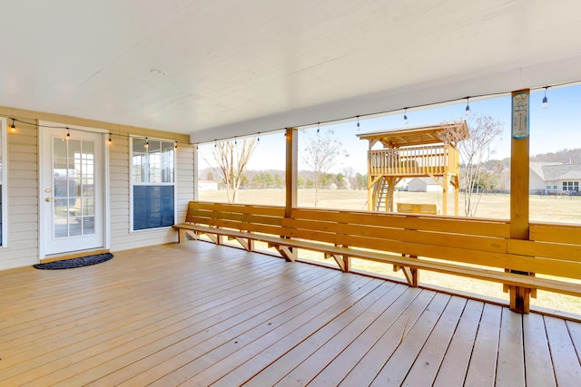 unfurnished sunroom with plenty of natural light