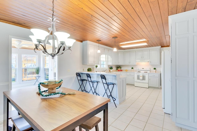 dining space featuring light tile patterned floors, a notable chandelier, and wooden ceiling