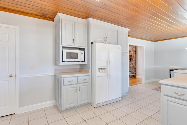 kitchen featuring light tile patterned floors, white appliances, wood ceiling, and light countertops