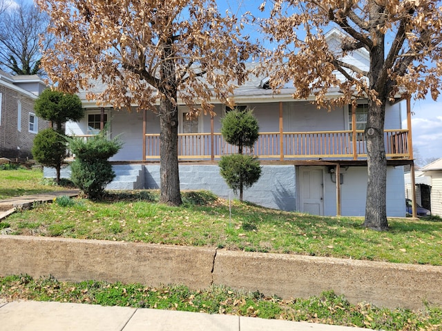 view of side of home with covered porch