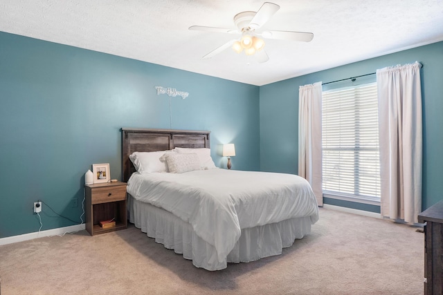 bedroom featuring baseboards, carpet, and a ceiling fan