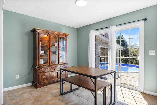 dining room featuring baseboards