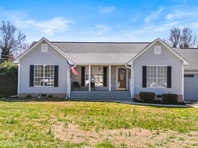 ranch-style home with covered porch, a front yard, and a shingled roof