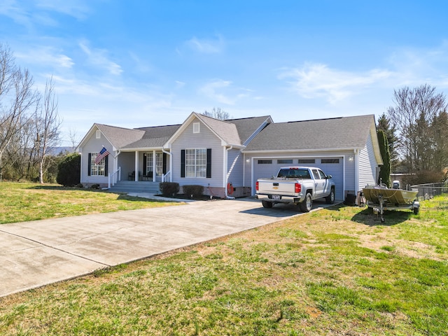 single story home featuring a garage, concrete driveway, and a front yard