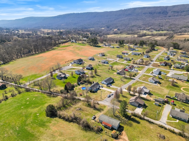 drone / aerial view featuring a rural view and a mountain view